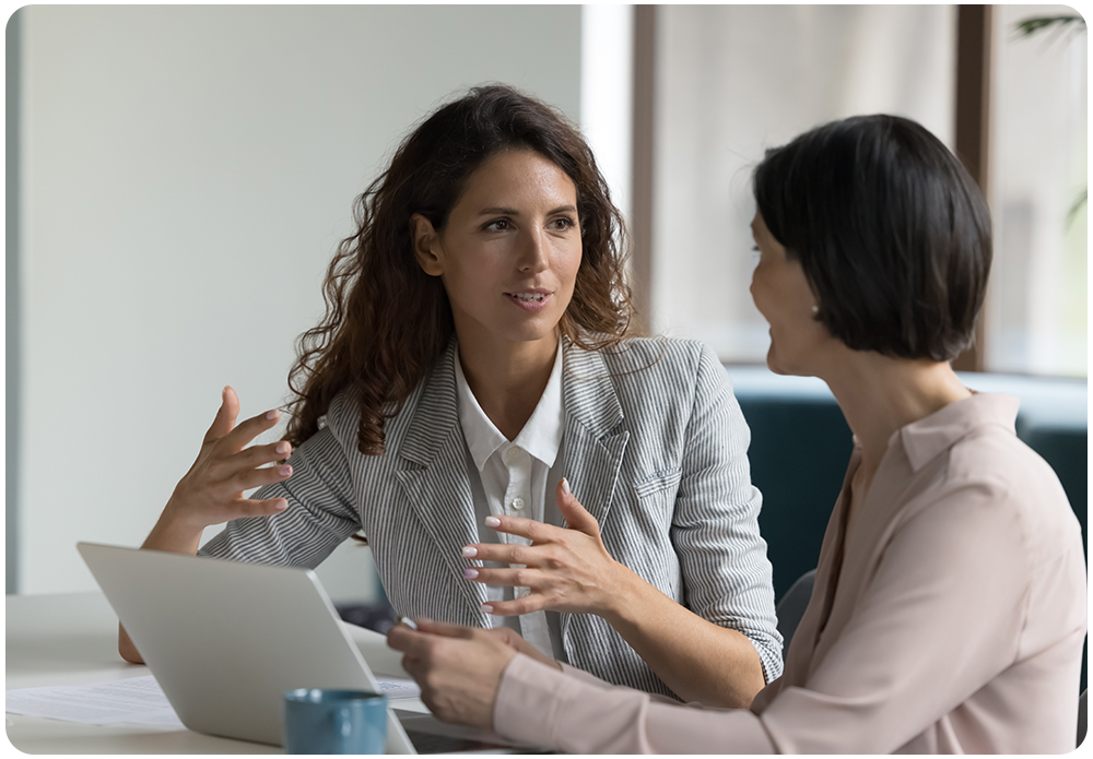 Executive coaching session between coach and senior manager