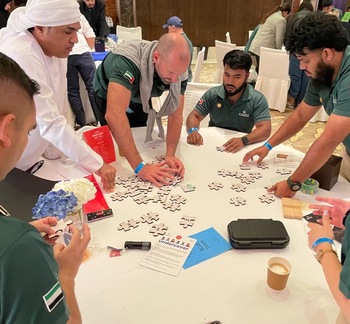 Puzzle-based team challenge solving problems under time pressure